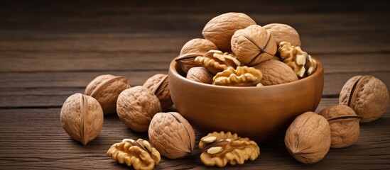 Poster - Walnuts in a dish on a wooden surface