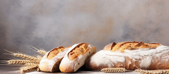 Poster - Two bread loaves on a table with wheat