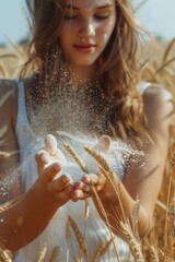 Poster - A woman standing in a field of wheat sprinkled with flour. Suitable for food and agriculture concepts