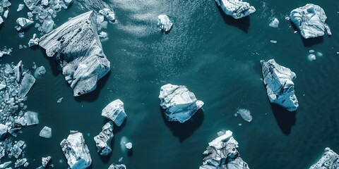 Canvas Print - A group of icebergs floating on top of a body of water. Ideal for nature and climate change concepts