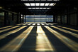 The sun casting shadows on a warehouse roof embedded with solar panels, a testament to sustainability efforts.