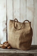 Aufkleber - A jute bag sitting on top of a wooden table, suitable for various design projects.