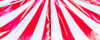 Circus tent background. Colorful design, striped white and red, retro style.
