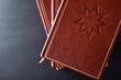 Stack of books with engraved symbol  shenist top view