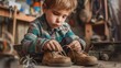 A young boy repairing a pair of old shoes with duct tape.