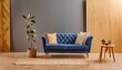 Blue Elegance: Mockup Living Room Interior with a Blue Sofa on a Dark Blue Wall Background