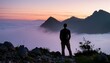 Silhouette of a Solo Adventurer in Fog-Laden Peaks at twilight in mountain