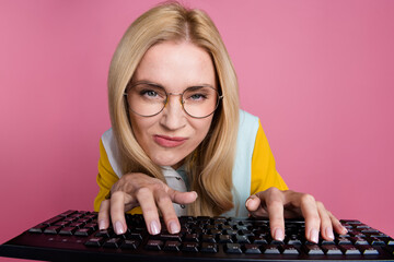 Poster - Photo of funky funny adorable woman hacking web site writing coding app isolated on pink color background