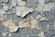 b'old weathered white and gray paint peeling off a wall'