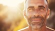 © Adobe Contributor - b'Bearded man smiling in the sunlight'