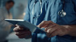 © Peopleimages - AI - Man, doctor and hands online on tablet for test results or check hospital schedule and patient information. Male neurologist, digital tech and review healthcare apps or records and prescriptions.