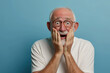 © Volodymyr - Nervous senior man in studio with oops reaction on blue background. Mistake, sorry, drama or secret with regret, shame or awkward