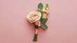 Word PROM with boutonniere on pink backgrounD