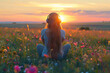 © Vovmar - Rear view of a girl with long hair in large headphones sitting in a field of flowers at dawn, sunset. Generated by artificial intelligence