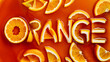Appetizing orange juice and fruit slices cut out into letters and arranged to form the word 'orange' in a creative typography style.