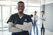 © peopleimages.com - Male Doctor, hospital and portrait with team for medical service, healthcare and insurance for medicine. Expert nurse, clinic and confident for wellness. health worker or specialist surgeon for help