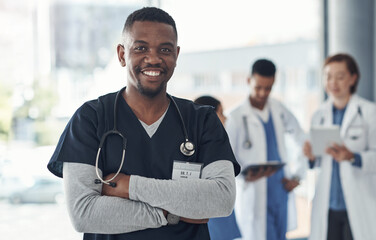 Canvas Print - Black man, nurse and arms crossed in hospital or medical meeting with confidence, integrity or about us. Portrait of healthcare doctor in leadership with ADN support, advice or planning in USA clinic