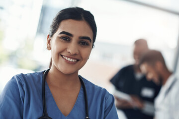 Wall Mural - Portrait, nurse and smile of woman in hospital for healthcare career, wellness and service. Face, happy and young medical professional doctor, surgeon or confident expert employee coworking in clinic