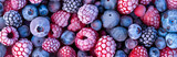 Fototapeta  - Mix of frozen berries, blueberries and raspberries, closeup photo from above, natural organic vegan raw food ingredient.