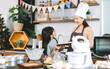 Happy asian family mother and daughter cooking in kitchen bake cake at home