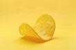 potato chip isolated on yellow background