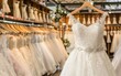 White wedding dresses hanging on hangers, luxury bridal shop boutique - Elegance, Bridal Fashion, Retail Display - Wedding Industry, Fashion Retail