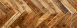 Elegant luxurious bright brown parquet laminate vinyl floor with herringbone pattern, flooring rustic oak wooden - wood timber panel decor texture flooring wall background, top view