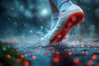 Football player running on the pitch. Close up of football shoes on the wet grass.