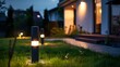 Panoramic photo of led light posts Illuminated backyard garden during night hours modern backyard outdoor lighting systems