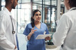 © peopleimages.com - Nurse, doctors and discussion with tablet, results and digital app for health and medicine. Team, hospital and planning for medical trial, help and life insurance with communication and collaboration