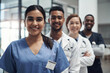 © peopleimages.com - Doctors, group and portrait with woman in hospital, diversity or solidarity for medical career in row. Medic team, men and people for collaboration, wellness or happy for healthcare service in clinic
