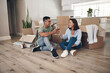 © peopleimages.com - Wine, toast or asian couple in new house floor celebration for moving, real estate and investment success. Property, growth or people in dream home with glass cheers for mortgage, loan or milestone