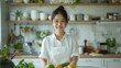 © duyina1990 - Portrait of a young Asian woman in a kitchen