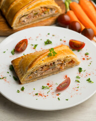 Wall Mural - Traditional Galician empanada filled with vegetables and anchovies. Traditional recipe from the northern part of Spain.