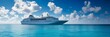 Large white cruise ship at sea against the background of the ocean and blue sky