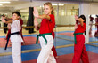 © JackF - Team of motivated teenagers are engaged in karate in the gym