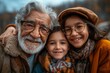 Elderly man in glasses smiling warmly while embracing two young granddaughters