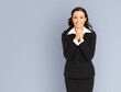 Portrait image - excited smiling positive businesswoman wear black confident suit, isolated grey gray background. Happy gesturing, praying hope for good luck woman. Business success ad concept.