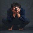 © T - Overwhelming Emotional Distress:Crouching Figure Hiding Face in Hands