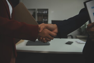 Wall Mural - Business handshake for teamwork of business merger and acquisition,successful negotiate,hand shake,two businessman shake hand with partner to celebration partnership and business deal concept