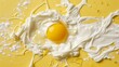 Egg yolk and milk splashes on yellow background, top view