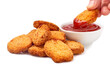 Heap of nuggets and dipping nugget in ketchup on white background