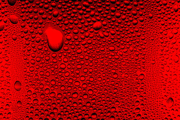 Wall Mural - Red close-up macro drink water drop surface,Water droplets on a glass of red cold drink for background and texture. (close up, selective focus, space for text)