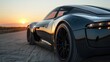 © NDmCX-Nic - A black sports car drives into the sunset.