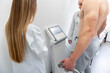 Health checkup in progress, a medical professional operates advanced diagnostic equipment