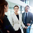 Business people, serious and discussion with manager for problem, solution or issue in conflict resolution at office. Employee group in conversation or corporate dispute with executive at workplace