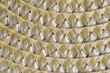 close up of straw mat,yellow background with a pattern
