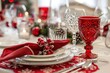 © evgenia_lo - Festive holiday table with crystal glasses and red glassware on a snowflake-patterned tablecloth.