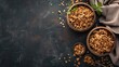 Assorted granola in wooden bowls on dark textured background. Healthy eating and nutrition concept