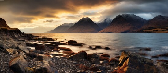 Canvas Print - A rocky seaside with distant mountains